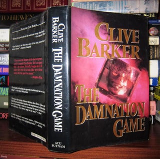 Item #47875 THE DAMNATION GAME. Clive Barker