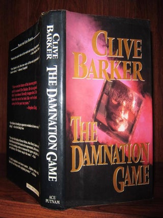 Item #47901 THE DAMNATION GAME. Clive Barker