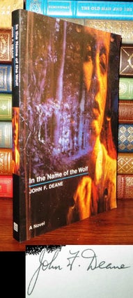 Item #61069 IN THE NAME OF THE WOLF Signed 1st. John F. Deane