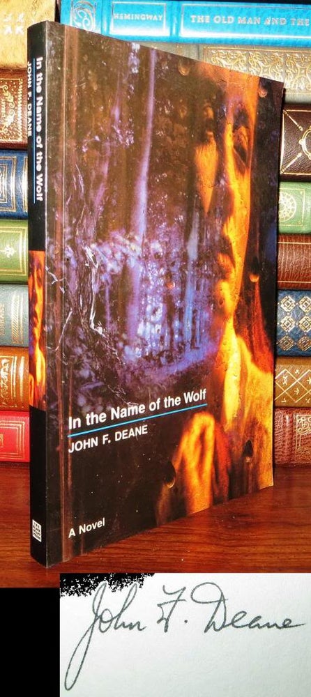 Item #61069 IN THE NAME OF THE WOLF Signed 1st. John F. Deane.