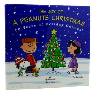 Item #87686 THE JOY OF A PEANUTS CHRISTMAS 50 Years of Holiday Comics! Charles M. Schulz