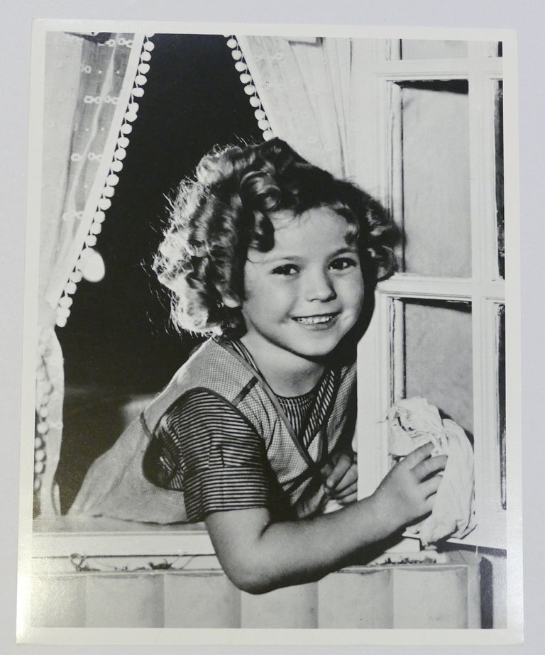 Item #134478 SHIRLEY TEMPLE PHOTO cleaning window. Shirley Temple.