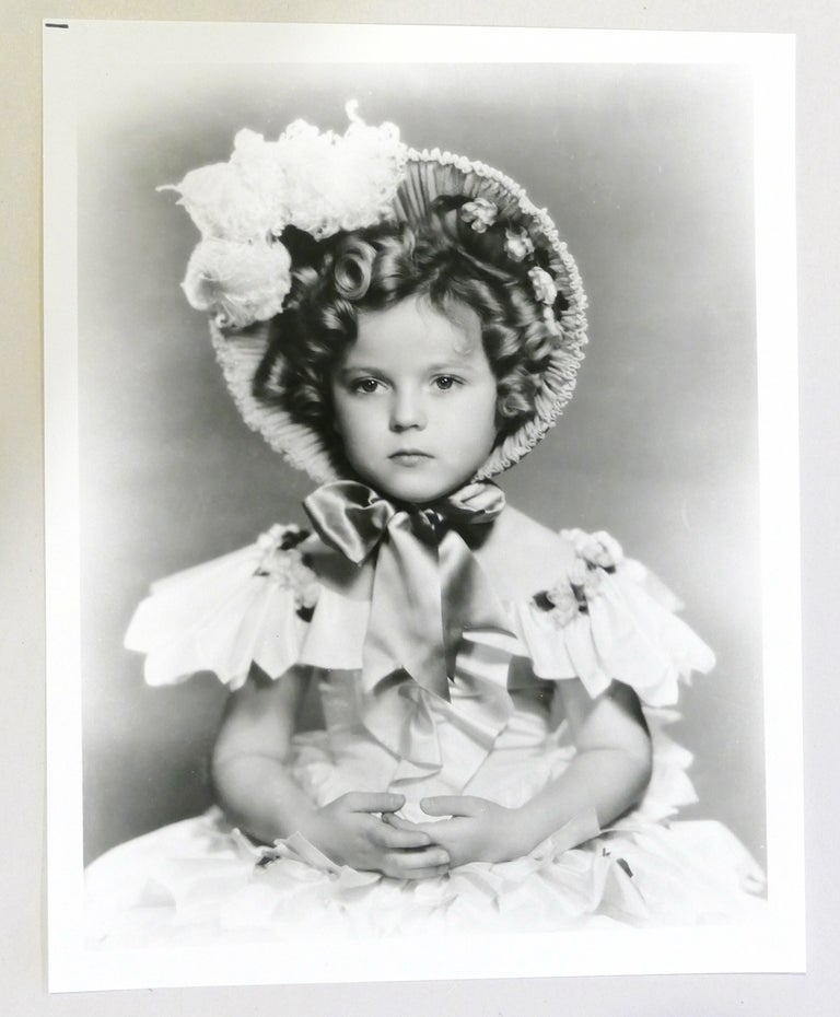 Item #134488 SHIRLEY TEMPLE PHOTO Sad face in dress. Shirley Temple.