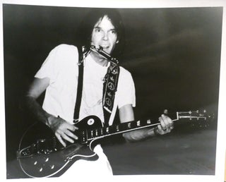 Item #142773 NEIL YOUNG PLAYING GUITAR PHOTO 8'' x 10'' inch Photograph. Neil Young