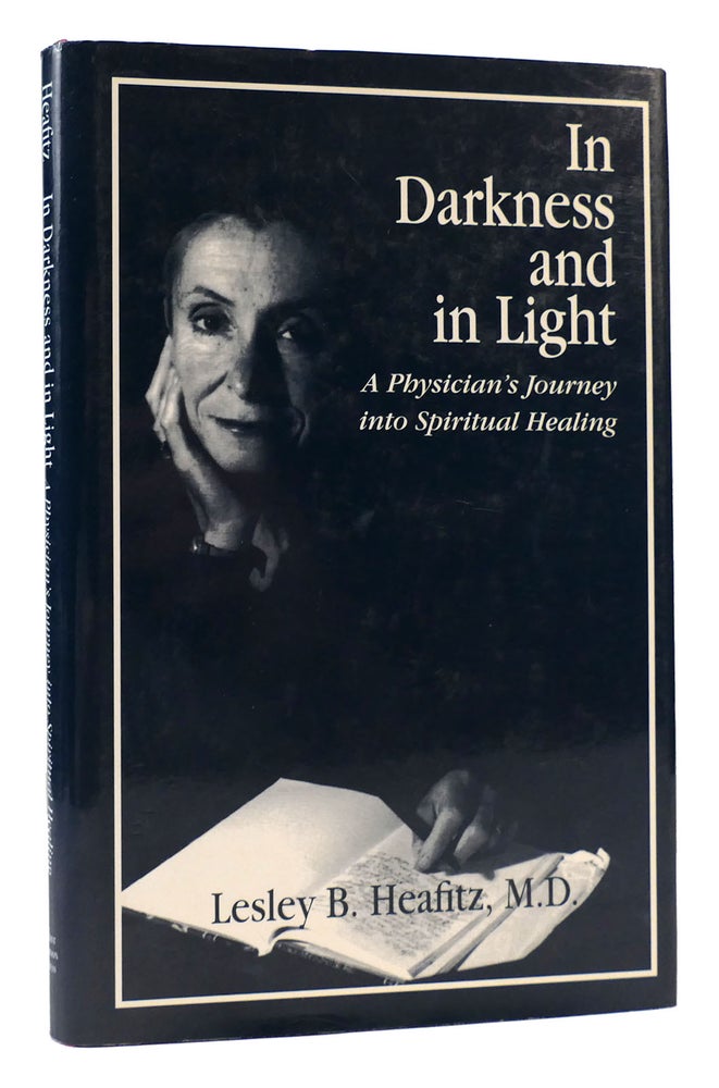 Item #168447 IN DARKNESS AND IN LIGHT A Physician's Journey Into Spiritual Healing. Lesley B. Heafitz.